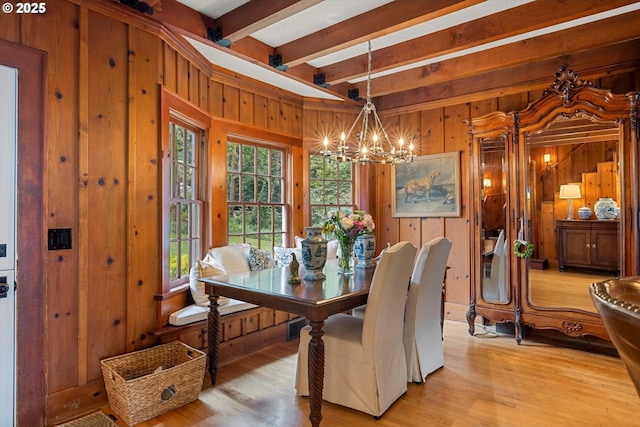 1667 Lake Front Rd, Lake Oswego, OR 97034 - dining area featuring wooden walls, a chandelier, beamed ceiling, and light wood-type flooring