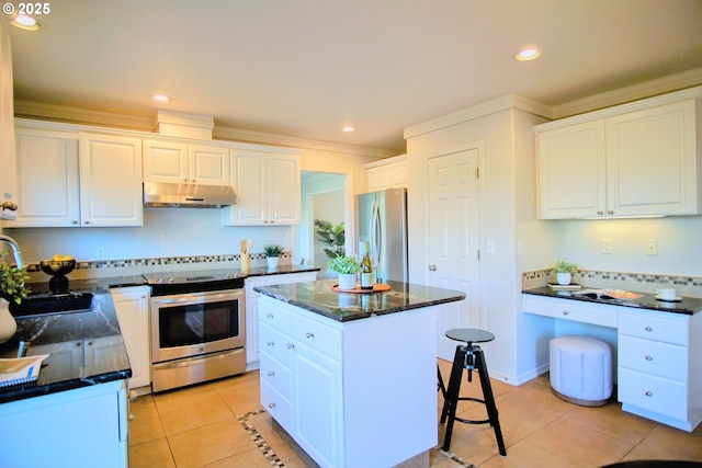 kitchen featuring light tile patterned floors, appliances with stainless steel finishes, white cabinetry, and under cabinet range hood