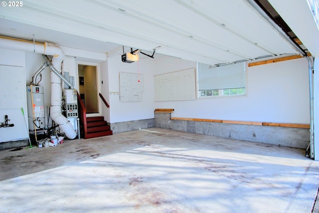 garage with a garage door opener and water heater