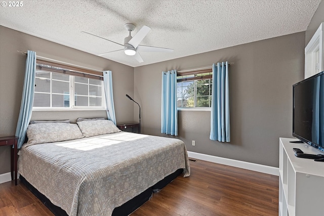 1050 D St, Baker City, OR 97814 - bedroom with wood finished floors, a textured ceiling, and a ceiling fan