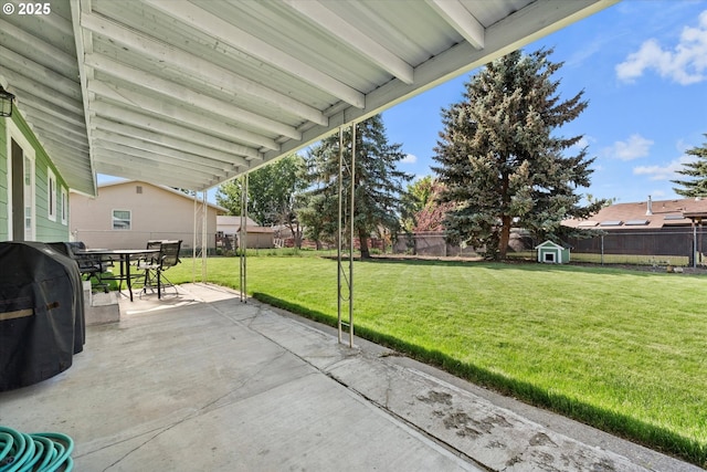 1050 D St, Baker City, OR 97814 - fenced backyard with a patio, a storage shed, outdoor dining area, and a grill