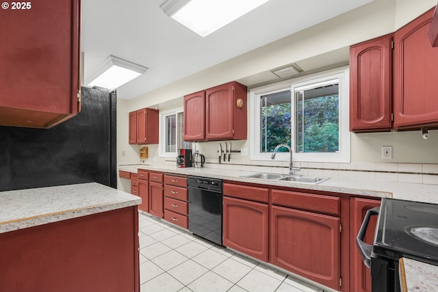 19330 NW Curtis Creek Dr, Manning, OR 97125 - kitchen with black appliances, a sink, light tile patterned floors, light countertops, and reddish brown cabinets