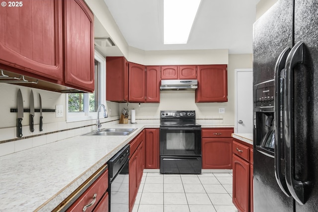 19330 NW Curtis Creek Dr, Manning, OR 97125 - kitchen with black appliances, under cabinet range hood, a sink, reddish brown cabinets, and light tile patterned floors