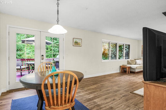 19330 NW Curtis Creek Dr, Manning, OR 97125 - dining area featuring plenty of natural light, wood finished floors, baseboards, and french doors