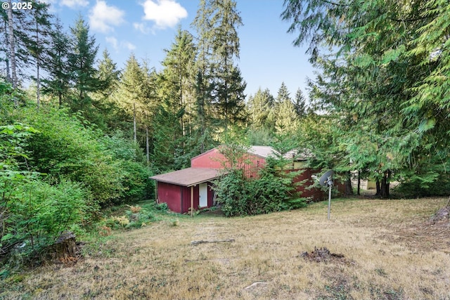 19330 NW Curtis Creek Dr, Manning, OR 97125 - view of yard with an outdoor structure and a wooded view