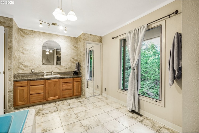 19330 NW Curtis Creek Dr, Manning, OR 97125 - full bathroom featuring vanity, ornamental molding, a chandelier, baseboards, and tile patterned flooring