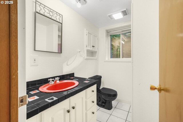 19330 NW Curtis Creek Dr, Manning, OR 97125 - bathroom featuring vanity, toilet, tile patterned floors, and baseboards