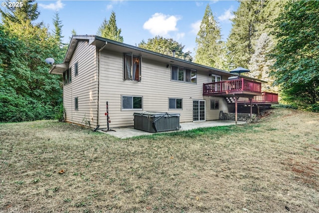 19330 NW Curtis Creek Dr, Manning, OR 97125 - rear view of house featuring a hot tub, a patio area, a wooden deck, and a yard