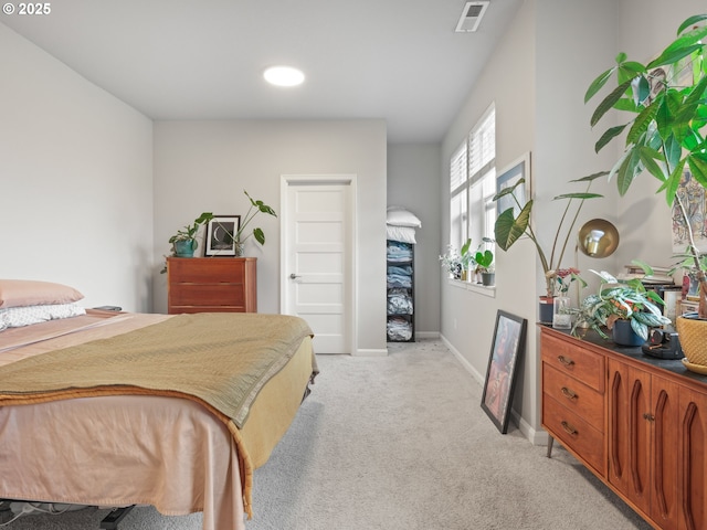 bedroom featuring light carpet