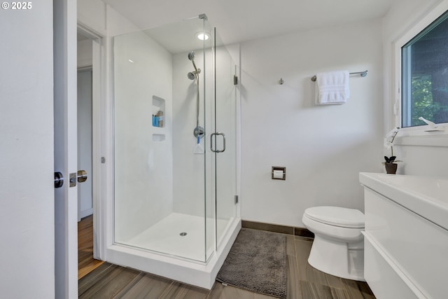 2435 Skyline Blvd, Eugene, OR 97403 - full bath featuring wood finished floors, a shower stall, toilet, and vanity