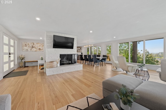 2435 Skyline Blvd, Eugene, OR 97403 - living room with a fireplace, light wood-style flooring, and recessed lighting
