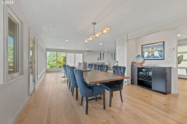 2435 Skyline Blvd, Eugene, OR 97403 - dining area featuring a wall unit AC, light wood-type flooring, and recessed lighting