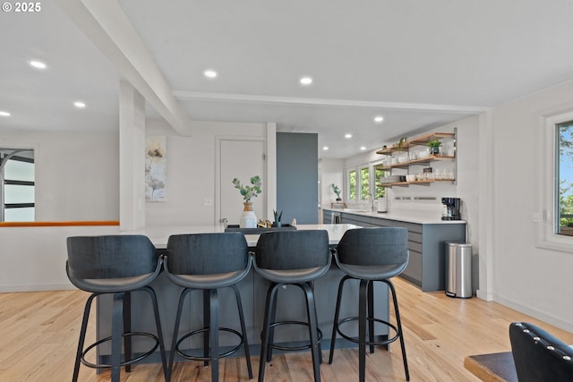 2435 Skyline Blvd, Eugene, OR 97403 - kitchen with light countertops, light wood-style flooring, a breakfast bar area, and recessed lighting