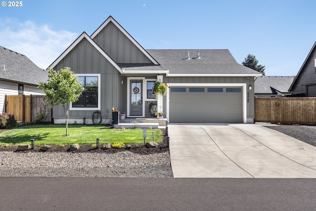 32750 Macy St, Eugene, OR 97408 - view of front of home with board and batten siding, a garage, concrete driveway, and a shingled roof
