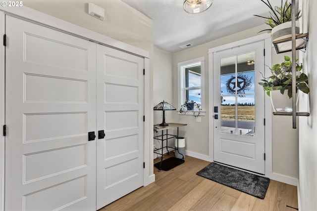 32750 Macy St, Eugene, OR 97408 - foyer with light wood-type flooring and a textured ceiling