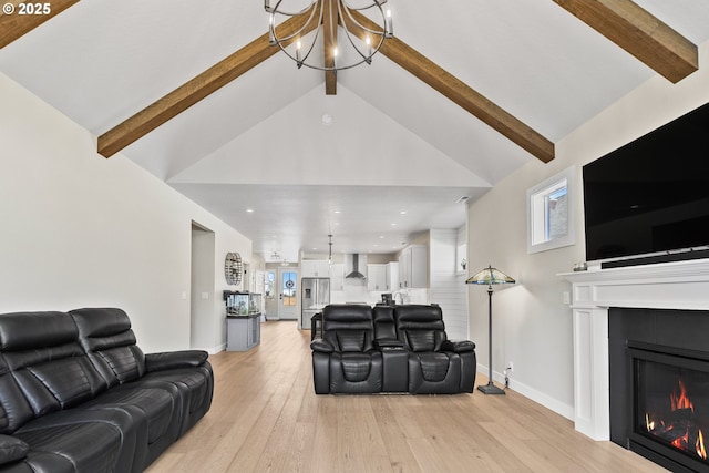 32750 Macy St, Eugene, OR 97408 - living area featuring a chandelier, a glass covered fireplace, light wood-type flooring, healthy amount of natural light, and recessed lighting