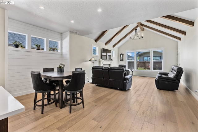 32750 Macy St, Eugene, OR 97408 - dining room with a chandelier, light wood-style flooring, recessed lighting, and a textured ceiling