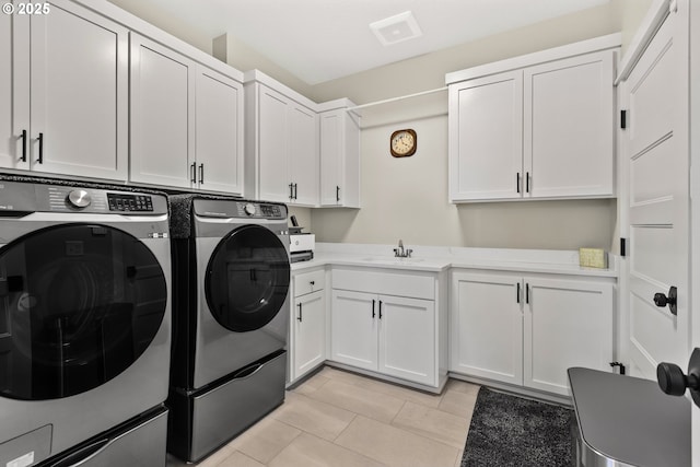 32750 Macy St, Eugene, OR 97408 - washroom with cabinet space, separate washer and dryer, and light tile patterned flooring