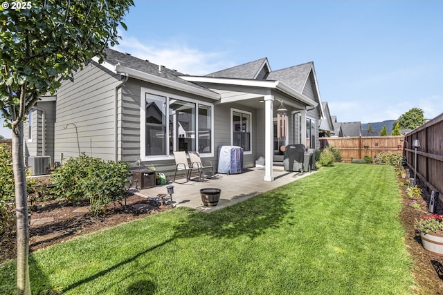 32750 Macy St, Eugene, OR 97408 - back of property with roof with shingles, a fenced backyard, and a patio