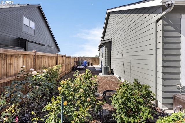 32750 Macy St, Eugene, OR 97408 - view of property exterior with a fenced backyard and a surveillance system