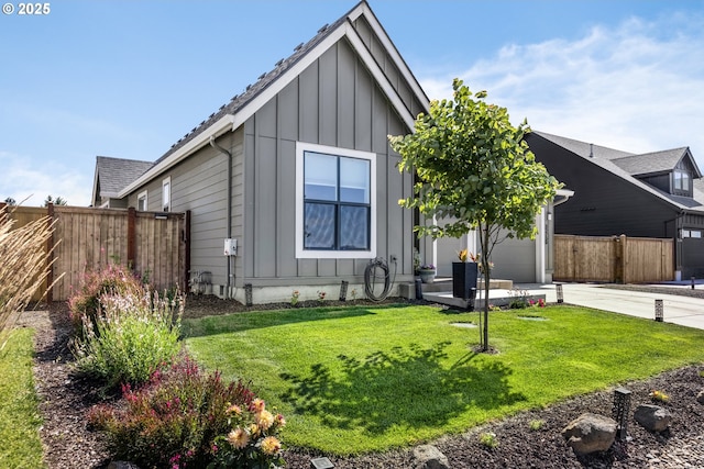 32750 Macy St, Eugene, OR 97408 - view of front of property with board and batten siding, an attached garage, and driveway