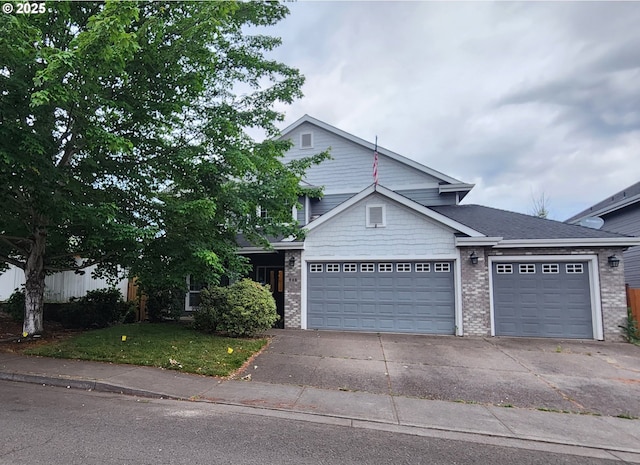 940 Harvey Ln, Molalla, OR 97038 - view of front of property featuring a garage, driveway, a front yard, and brick siding
