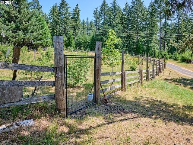 view of gate featuring fence