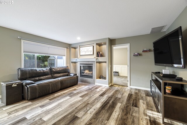 22647 SW Saunders Dr, Sherwood, OR 97140 - living room with wood finished floors, baseboards, and recessed lighting