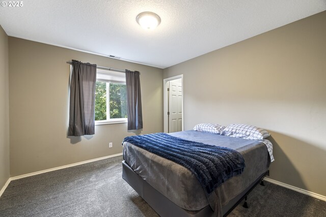 22647 SW Saunders Dr, Sherwood, OR 97140 - unfurnished bedroom with carpet, a textured ceiling, a spacious closet, and baseboards
