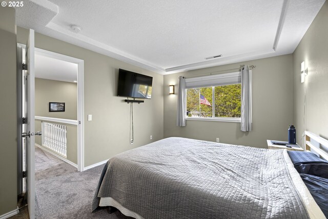 22647 SW Saunders Dr, Sherwood, OR 97140 - bedroom with baseboards, dark colored carpet, and ensuite bath