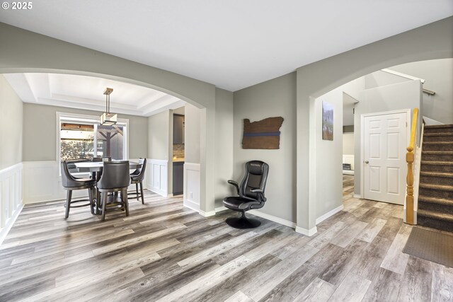 22647 SW Saunders Dr, Sherwood, OR 97140 - sitting room with arched walkways, wood finished floors, baseboards, and stairway