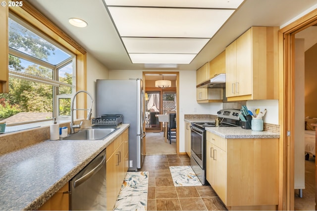 3327 Hillcrest Way, Forest Grove, OR 97116 - kitchen featuring appliances with stainless steel finishes, under cabinet range hood, light brown cabinets, and stone finish flooring