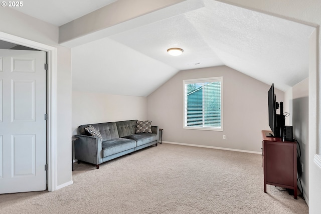 carpeted living room with a textured ceiling and lofted ceiling