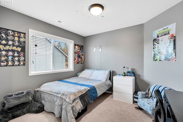 bedroom with light colored carpet