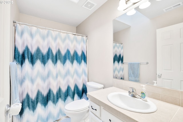 bathroom with toilet and vanity