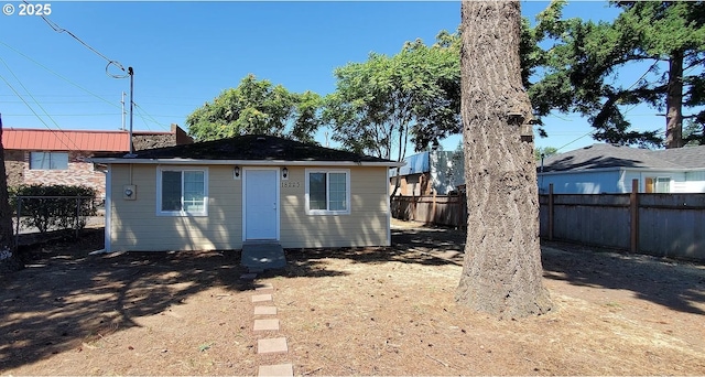 back of house featuring a fenced backyard