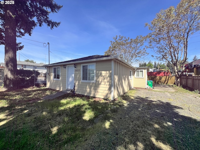 view of front of house featuring a fenced backyard