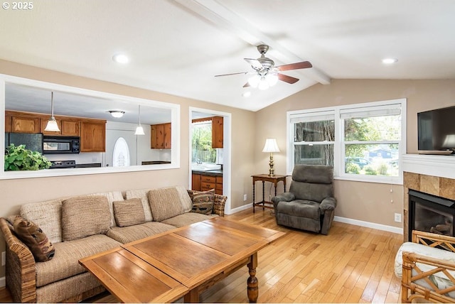 4976 NE K Ave, Neotsu, OR 97364 - kitchen with black appliances, decorative light fixtures, dark countertops, brown cabinetry, and baseboards