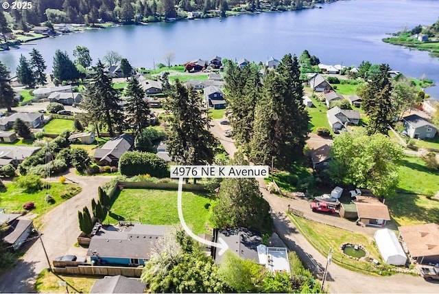 4976 NE K Ave, Neotsu, OR 97364 - aerial perspective of suburban area featuring a large body of water