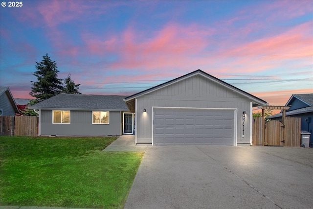 ranch-style house with concrete driveway and a garage