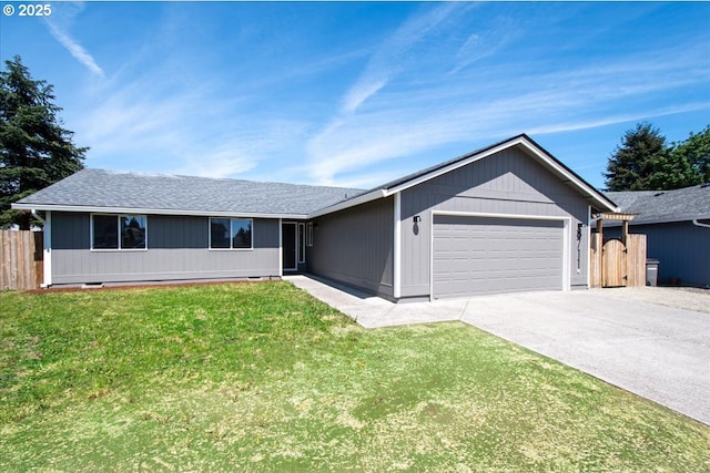 ranch-style house with an attached garage, driveway, and roof with shingles