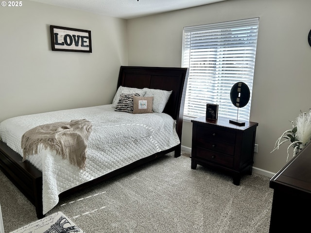 carpeted bedroom with baseboards