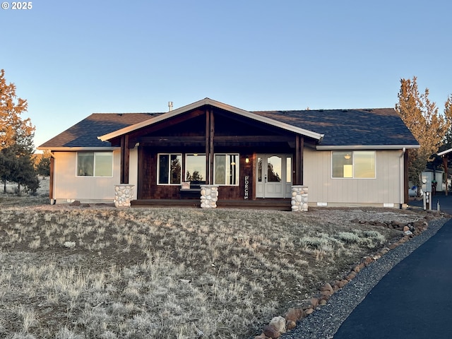 view of front of property with a shingled roof