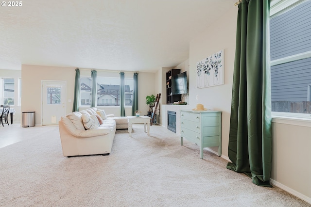 311 W Jadon Dr, Lebanon, OR 97355 - living area with carpet floors, baseboards, and a glass covered fireplace