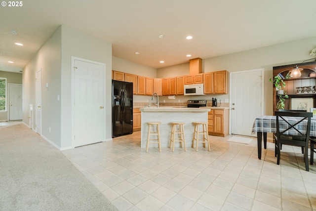 311 W Jadon Dr, Lebanon, OR 97355 - kitchen with black refrigerator with ice dispenser, white microwave, stainless steel electric range, light countertops, and recessed lighting