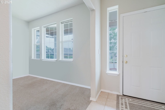 311 W Jadon Dr, Lebanon, OR 97355 - entryway with baseboards, light colored carpet, and light tile patterned floors