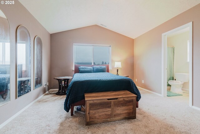 311 W Jadon Dr, Lebanon, OR 97355 - carpeted bedroom with lofted ceiling, ensuite bath, and baseboards