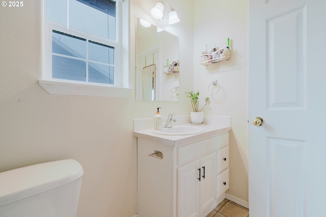 311 W Jadon Dr, Lebanon, OR 97355 - bathroom featuring vanity, toilet, and tile patterned flooring