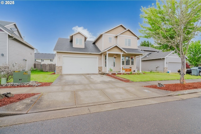 311 W Jadon Dr, Lebanon, OR 97355 - traditional home with driveway, stone siding, covered porch, and a garage
