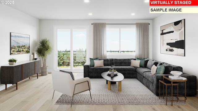 living area featuring plenty of natural light, recessed lighting, and wood finished floors